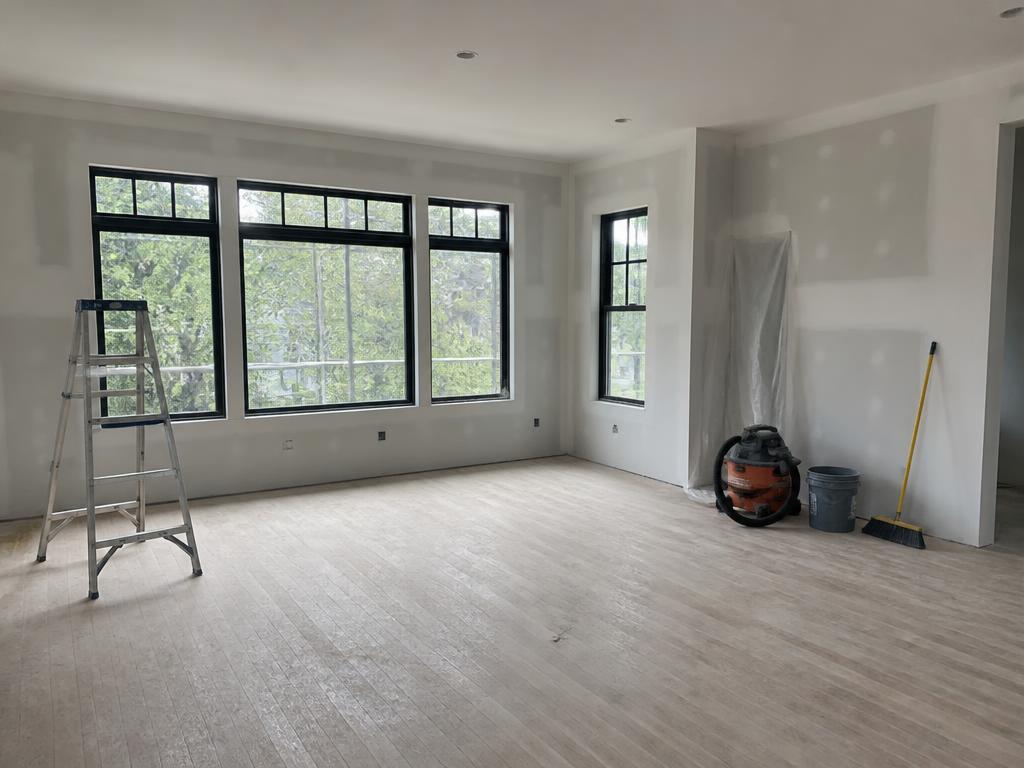 Worker cleaning a newly built room